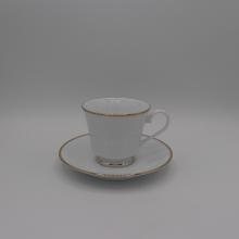 White cup and saucer with Gold Band